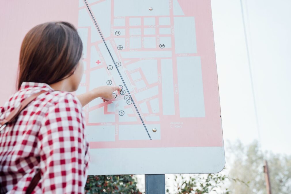 The woman is navigating a map of the building