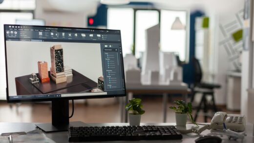 a PC monitor with 3D-rendering software and buildings concept