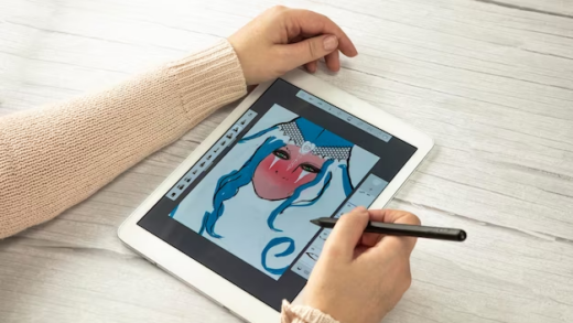 Woman using a stylus on an iPad for drawing