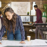 Designer Working on Blueprints in Office